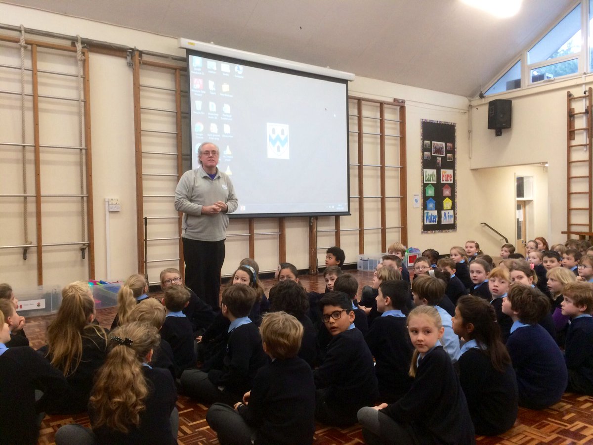 Ken Surridge chair of the charity Porridge and Rice talks to the school about life in the Nairobi slums