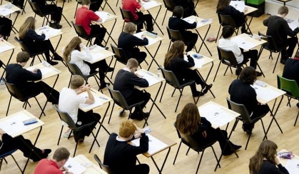 children and teenagers like those from KS Learning sitting for their exams, GCSE or A level